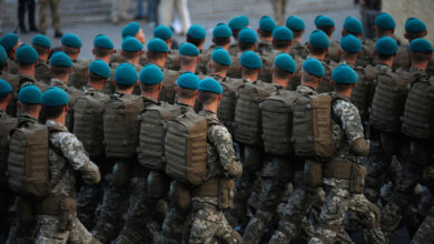 Soldiers paratroopers marching on square during military parade