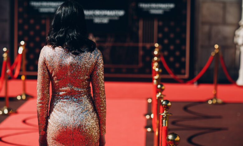 Woman in a luxurious dress on a red carpet