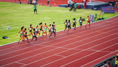 Female track and field race at athletics stadium. Professional female runners. Photo for athletics competition at summer olympic game Tokyo 2020.