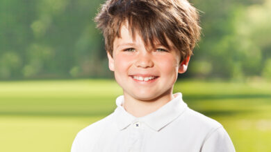 Outdoor portrait of joyful ten years old boy