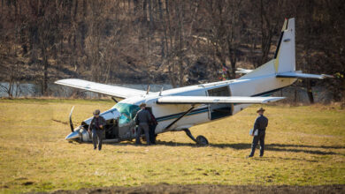 Crashed plane on field with police investigating