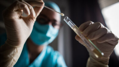 Doctor holding a coronavirus COVID-19 test tube