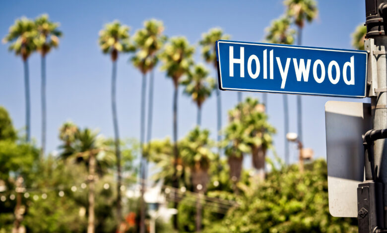 Hollywood boulevard sign, with palm trees in the background